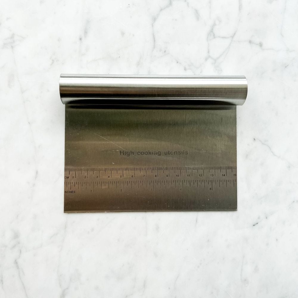 Sourdough bench scraper on marble
