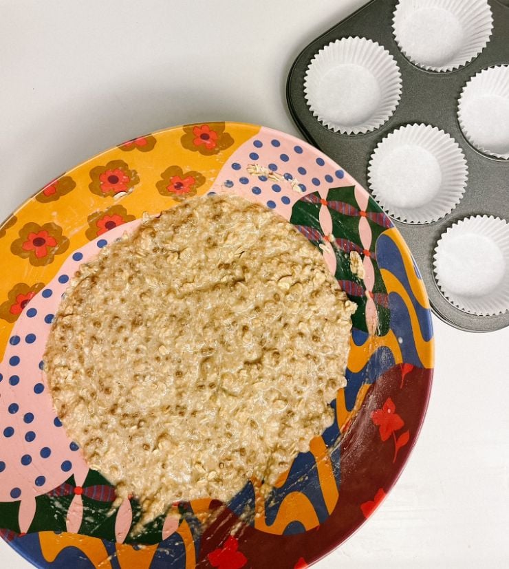 Oat Bran Sourdough muffin batter next to muffin tins