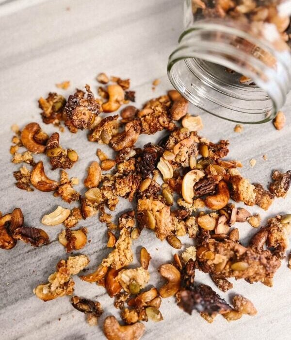 sourdough granola pouring out of a mason jar
