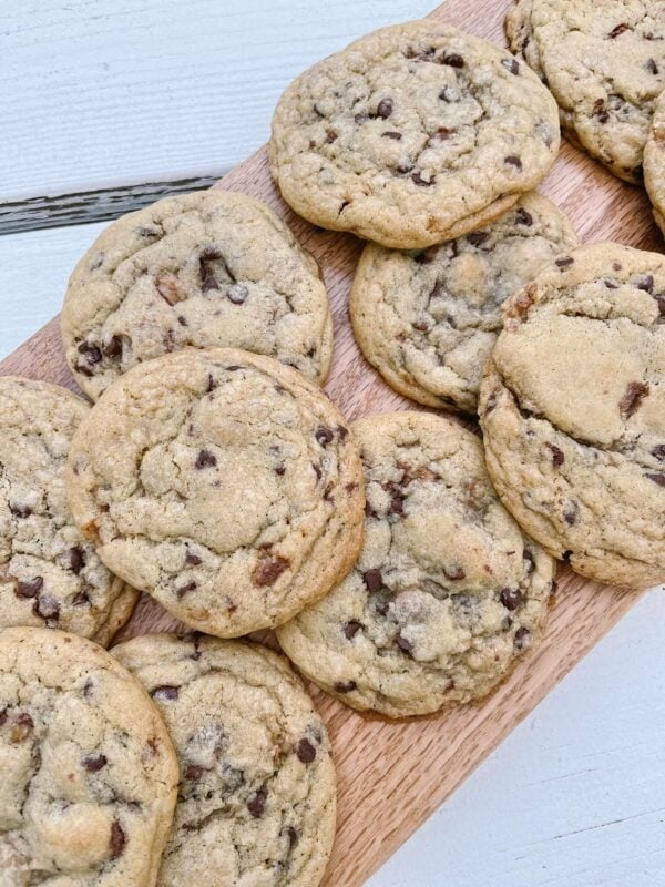 chocolate chip sourdough cookies on a wood charcuterie board