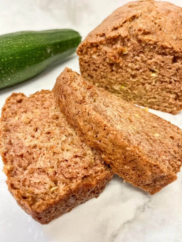 sliced sourdough zucchini bread with a zucchini