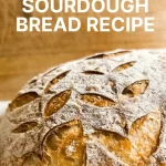 Sourdough bread with wheat stalk scoring with text beginner's sourdough bread recipe