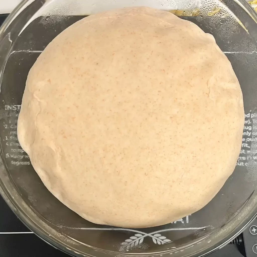 sourdough sandwich bread dough after the 1st rise and doubled in size