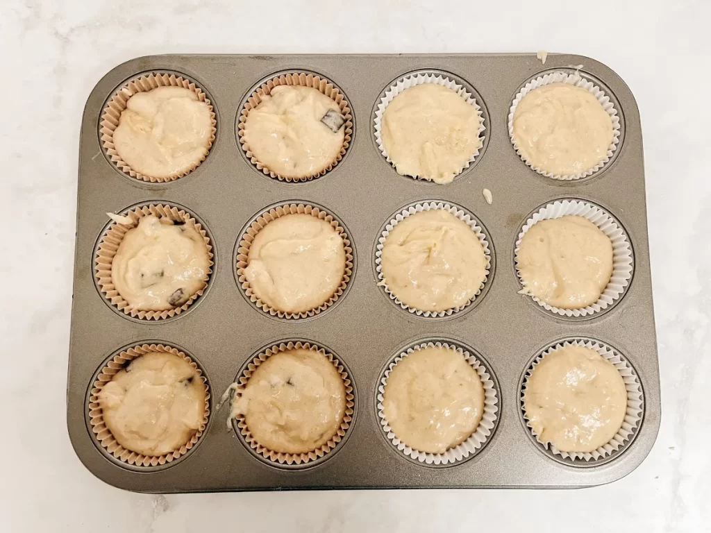 banana muffins in a muffin pan before baking