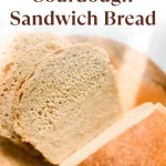 soft & fluffy sourdough sandwich bread with a loaf sliced