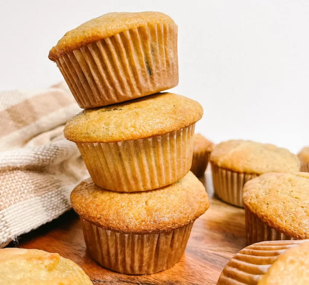 three sourdough banana muffins stacked on each other