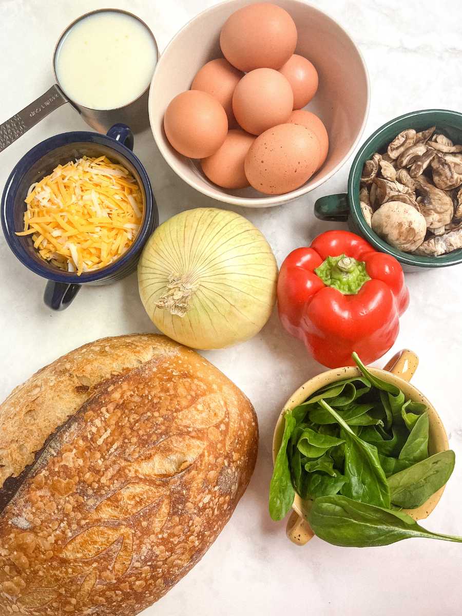 Bread, eggs, cheese, milk and veggies for sourdough casserole