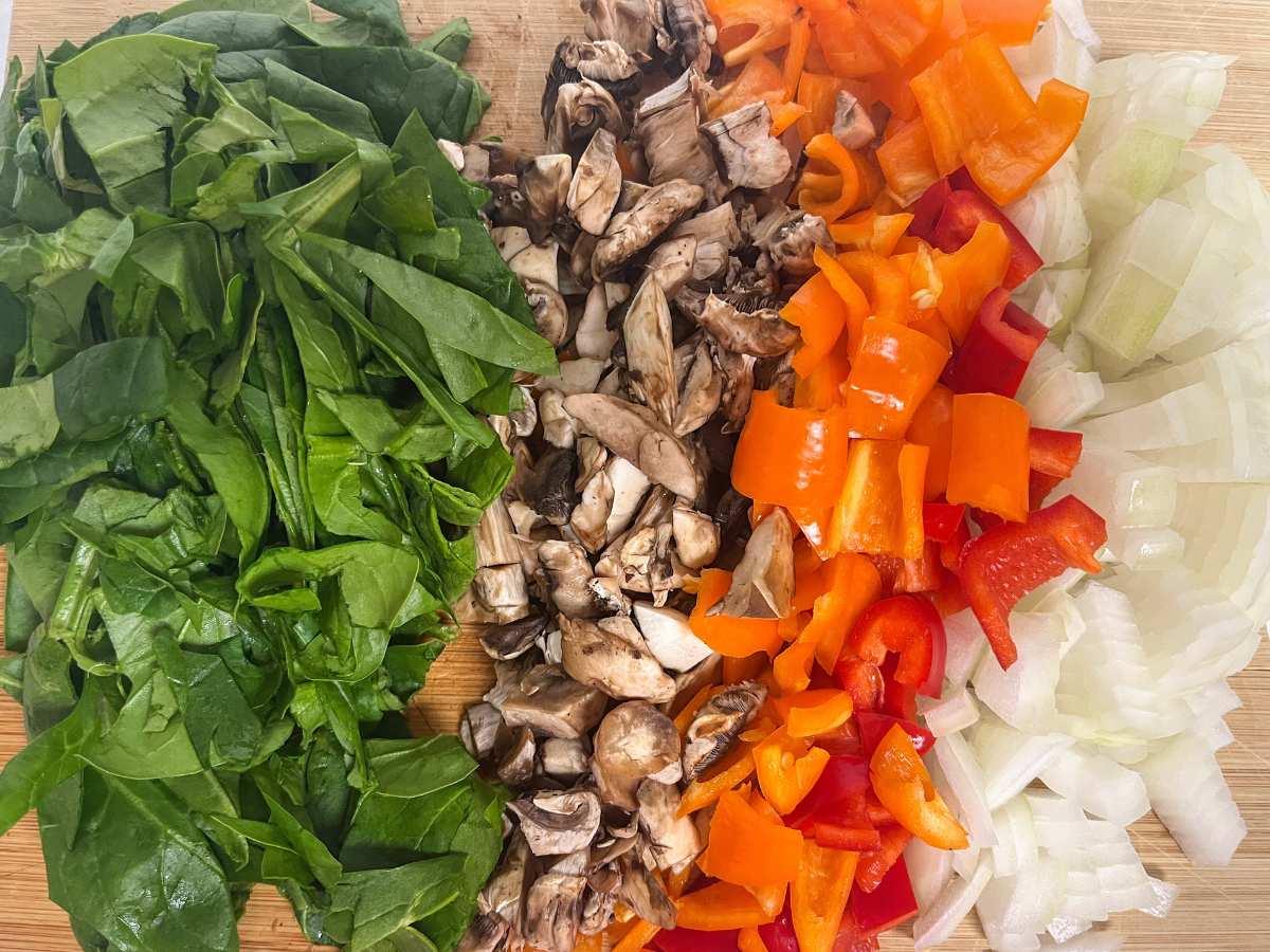 Chopped spinach, mushrooms, red bell pepper and onions