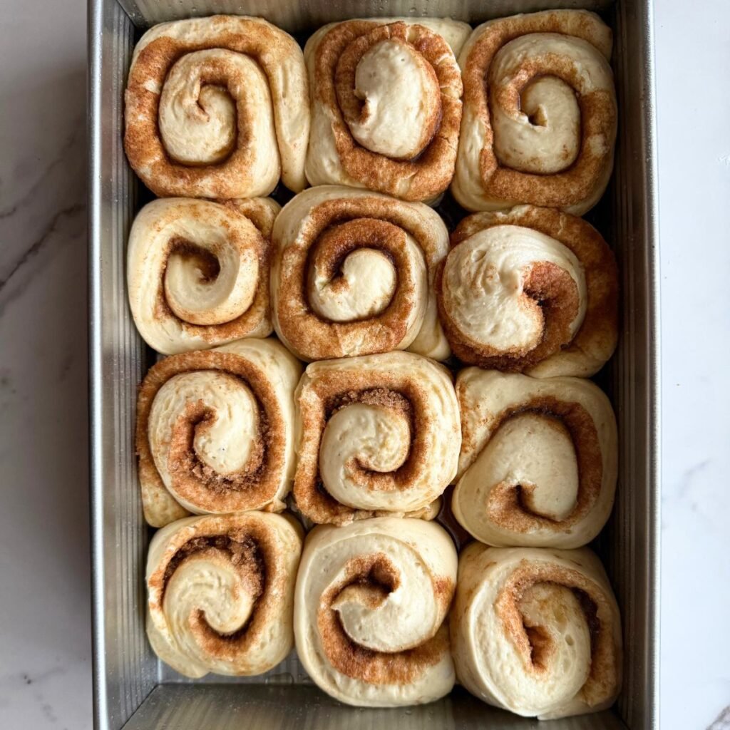 sourdough cinnamon rolls after second rise in a 9x13 pan.