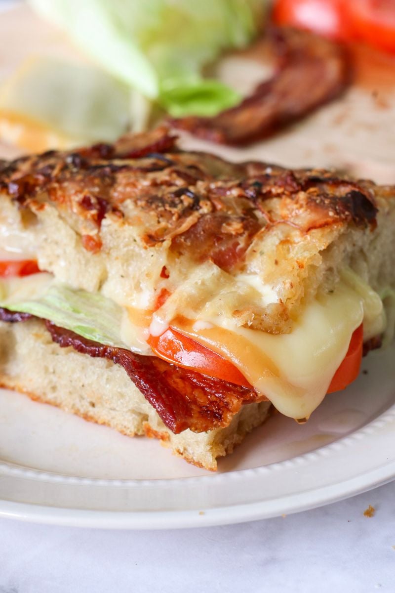 Close up on sandwich made with Cheddar Bacon Ranch Sourdough Focaccia