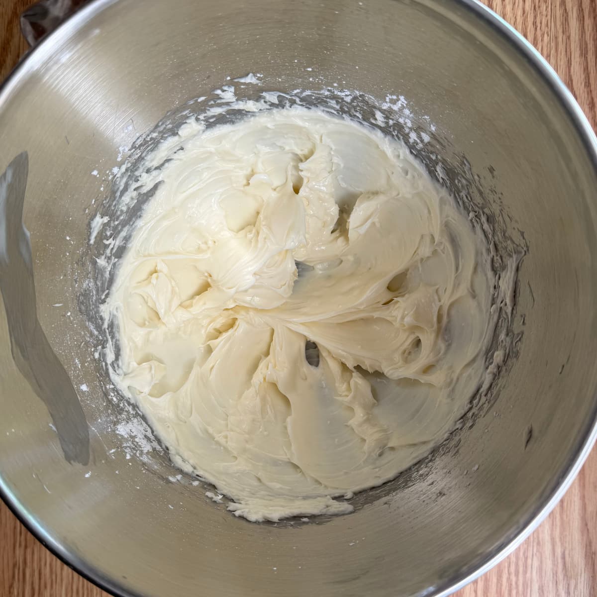 powdered sugar and cream cheese beat together until smooth in a mixing bowl.