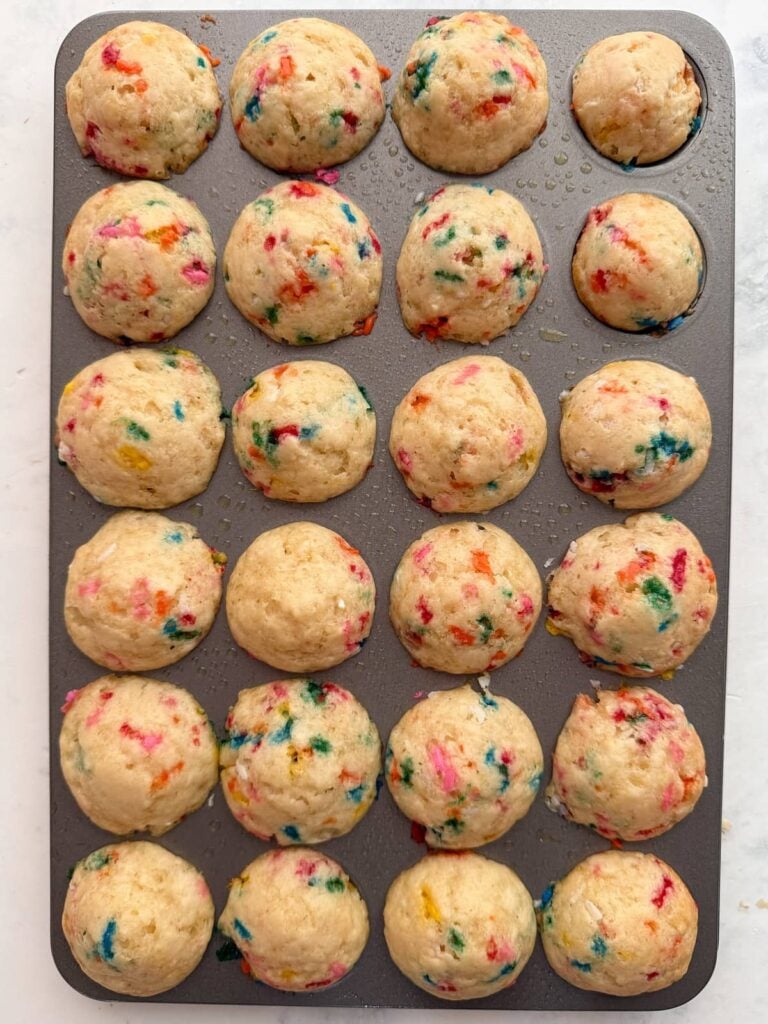 Freshly baked Sourdough Mini Muffins in a mini muffin pan.