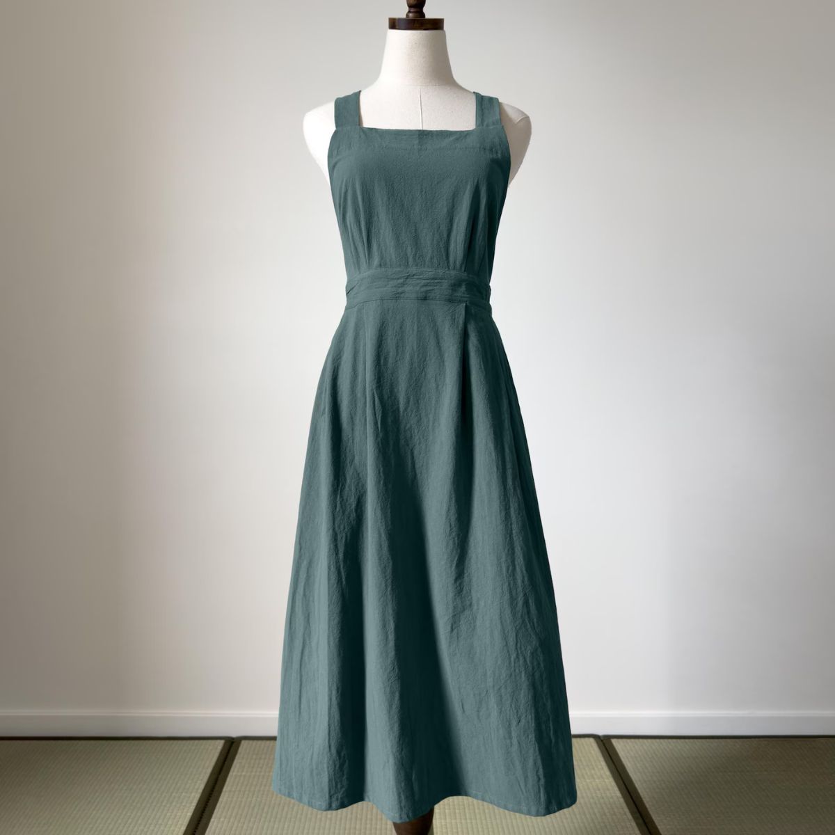 Green apron on a mannequin. 