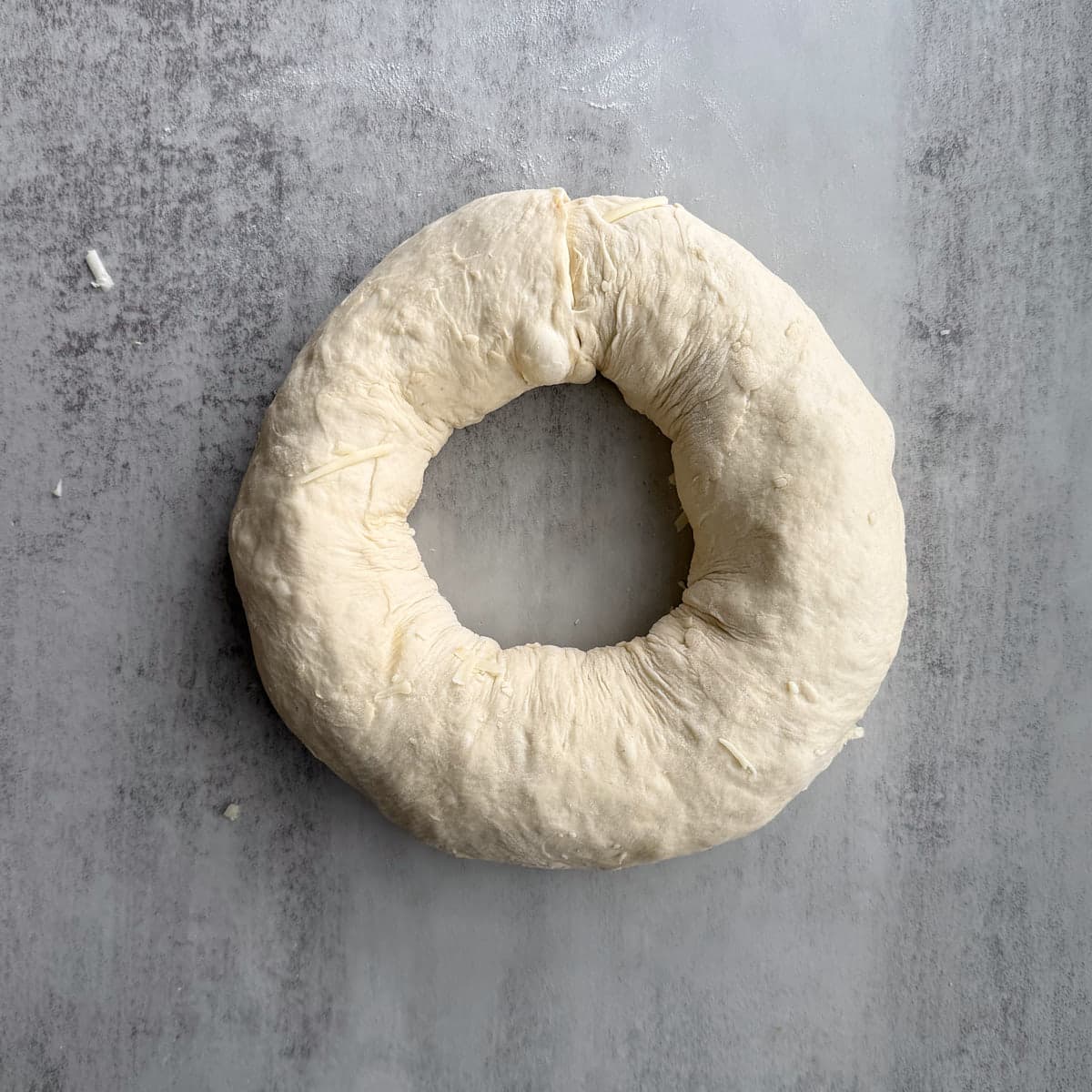 Sourdough pizza wreath shaped into a circle.