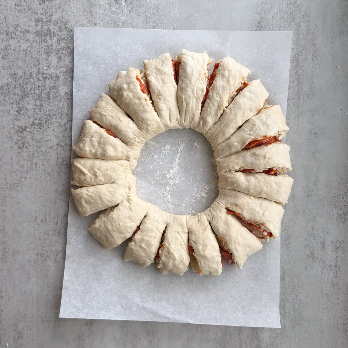 Slices made in the circle of sourdough pizza wreath dough.