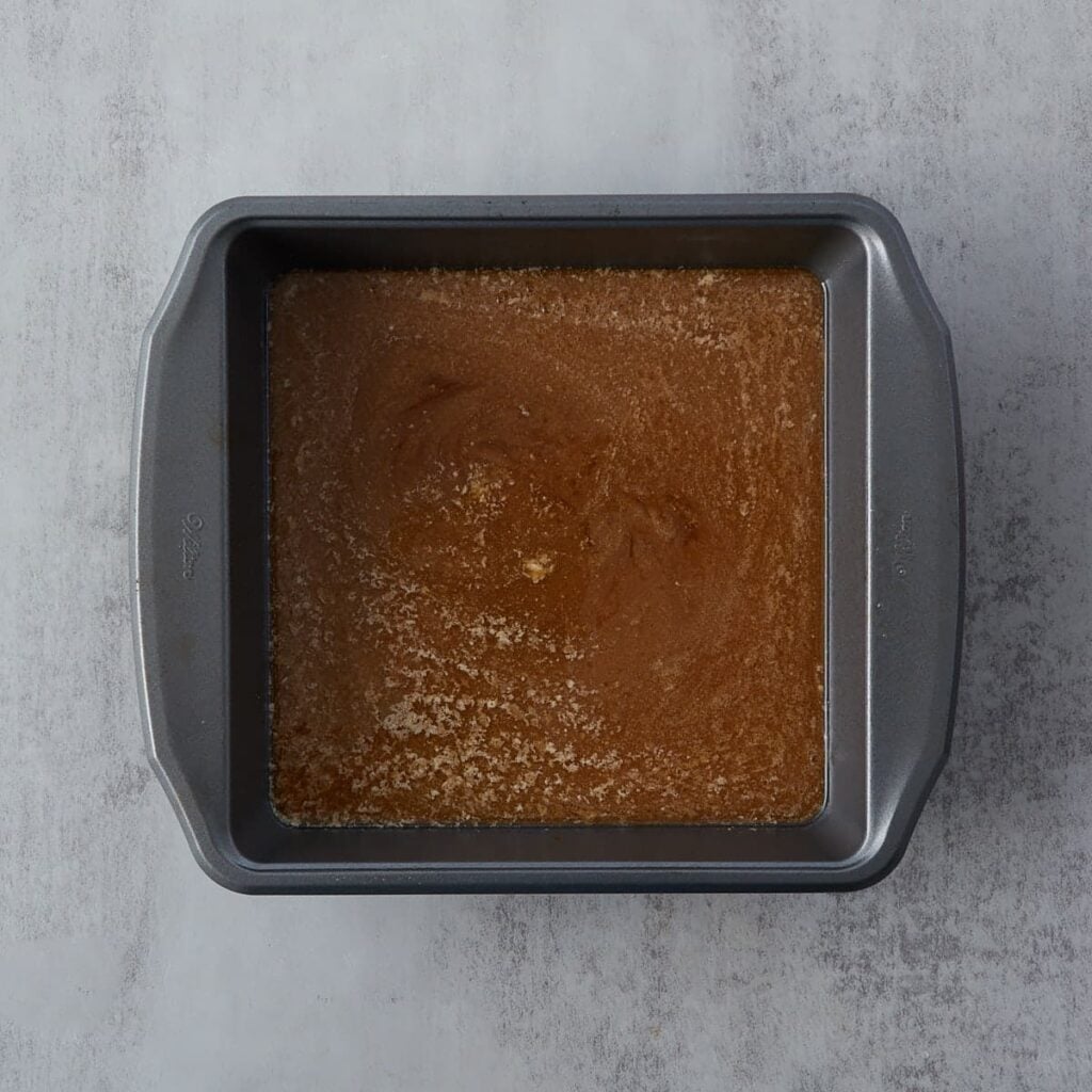 Caramel mixture in a 9x9 pan. 