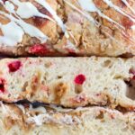 Slices of Cranberry Orange Sourdough Focaccia with a white chocolate drizzle.