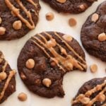 Chocolate peanut butter sourdough cookies with peanut butter chips and a drizzle of peanut butter.
