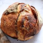 Overhead view of Cinnamon Honey Butter Sourdough Bread next to a white and brown napkin.