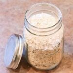 A mason jar filled with dried sourdough starter.