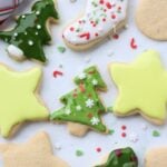 Sourdough discard sugar cookies cut in a tree, star and stocking shape with icing and sprinkles.