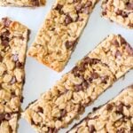 Sliced Sourdough Granola Bars with mini chocolate chips on a white background.