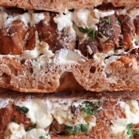 slices of bruschetta sourdough focaccia topped with a feta cheese and basil