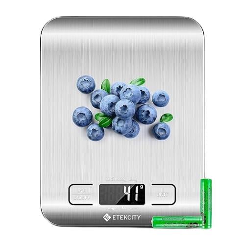 digital kitchen scale with blueberries on top. 