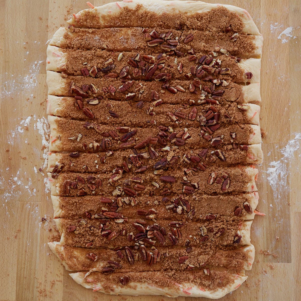Cinnamon sugar spread over the roll dough and cut into 12 slices. 
