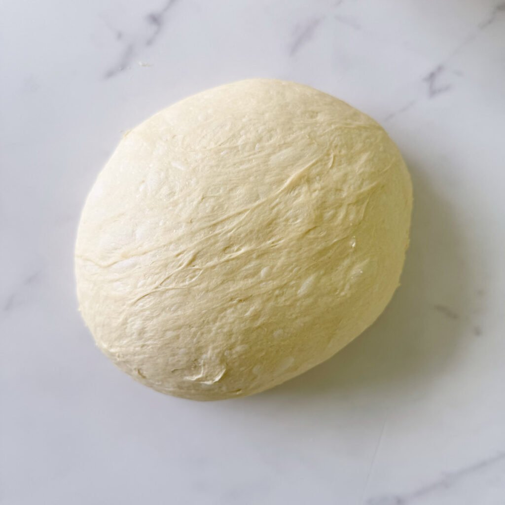 Dough for Einkorn Sourdough Bread shaped into a round loaf.