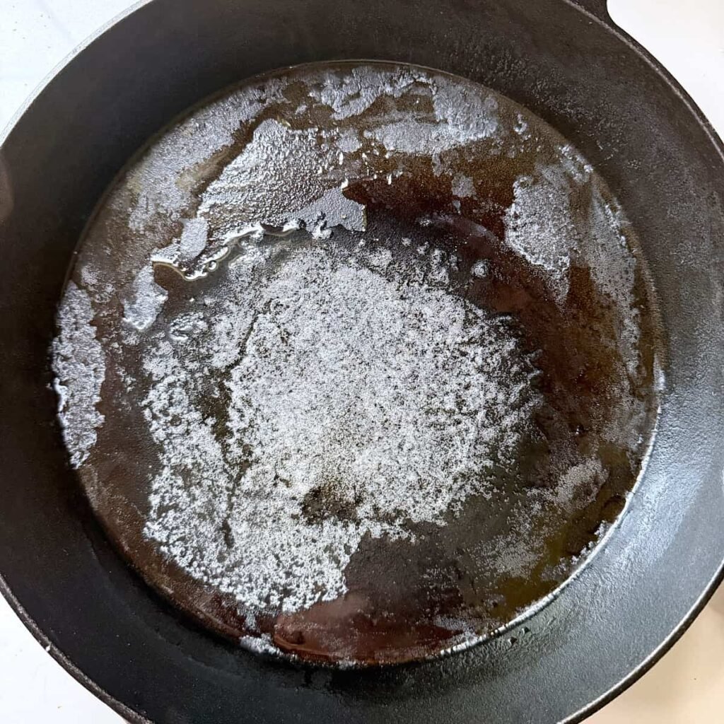 Melted butter in a cast iron pan.