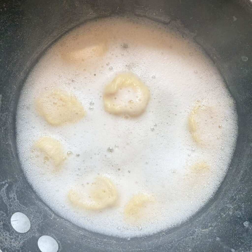 Sourdough Pretzel Bites in boiling water with baking soda.