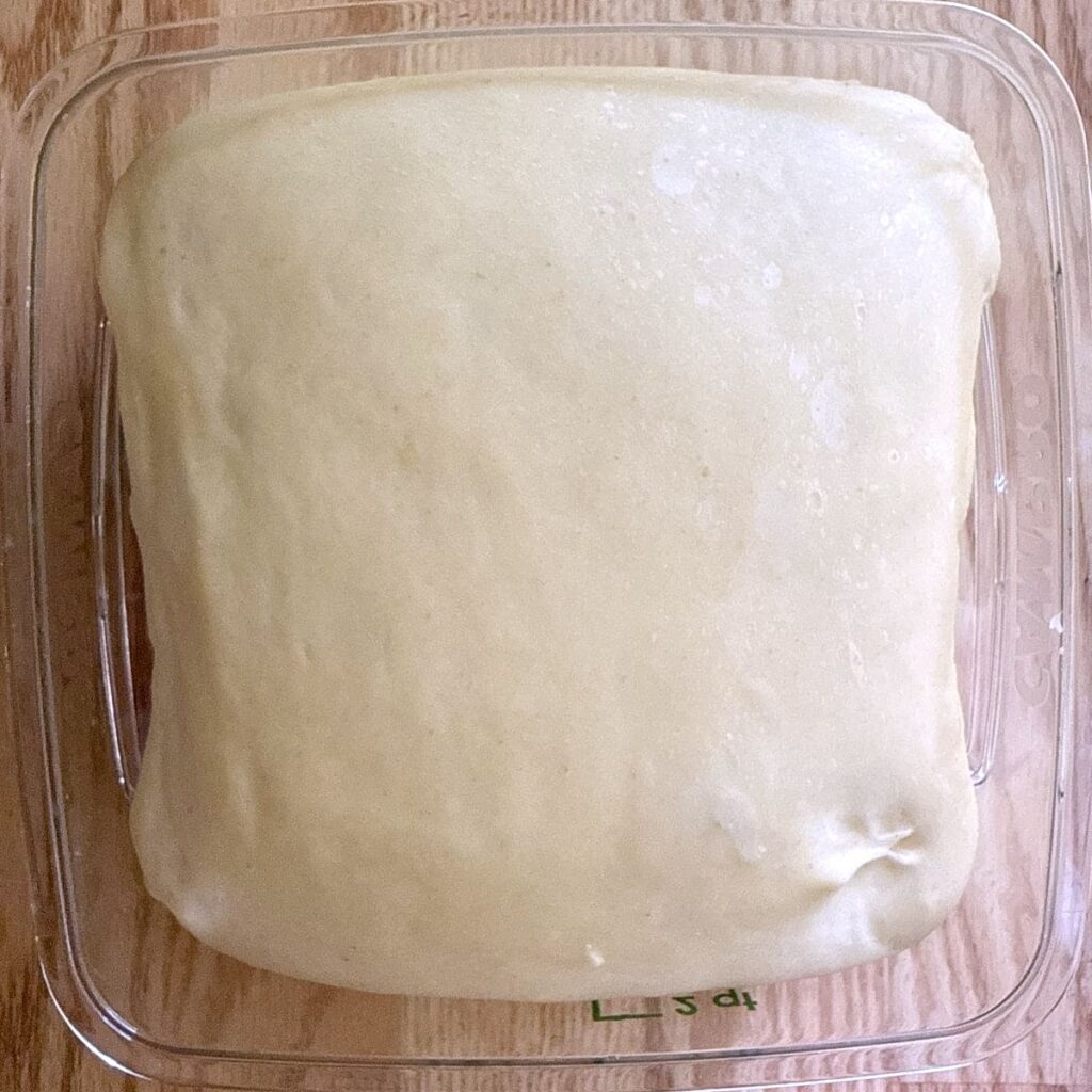 Sourdough hot dog bun dough after first rise.