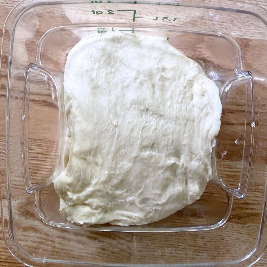 Dough for sourdough hot dog buns before first rise.