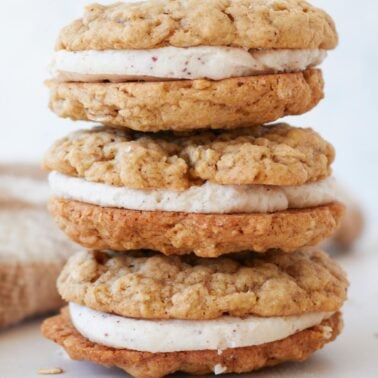 Three sourdough oatmeal cream pies stacked on top of each other.