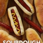 Hot dog with ketchup and mustard on a sourdough bun.