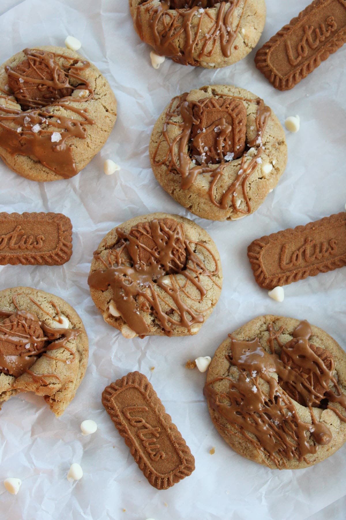 Cookie butter sourdough cookies next to Biscoff cookies and white chocolate chips.