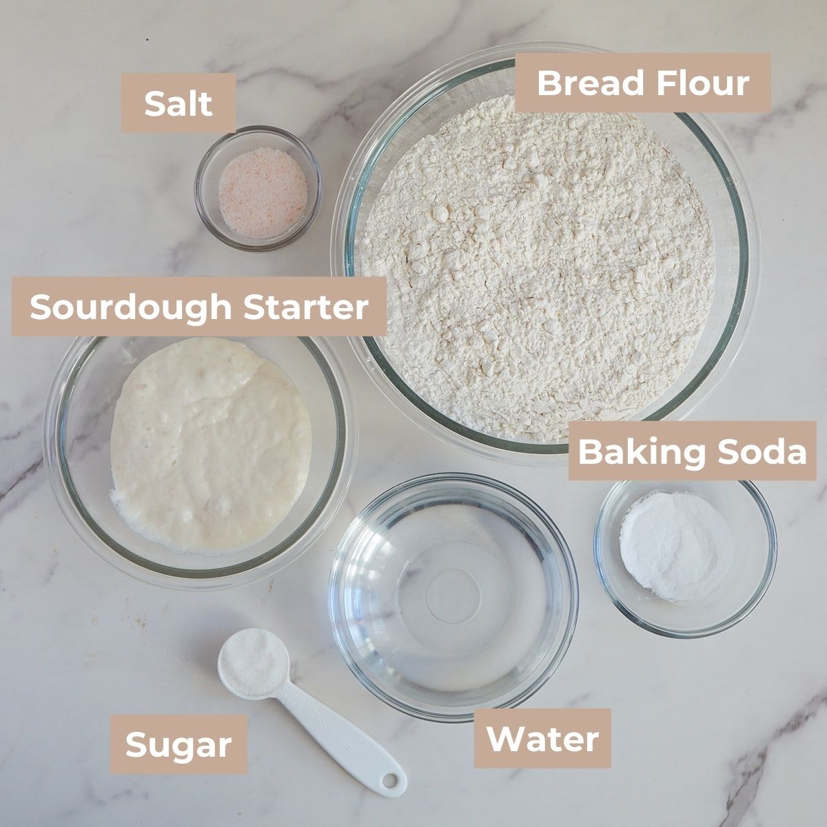 Ingredients for Sourdough Bagels in clear bowls.