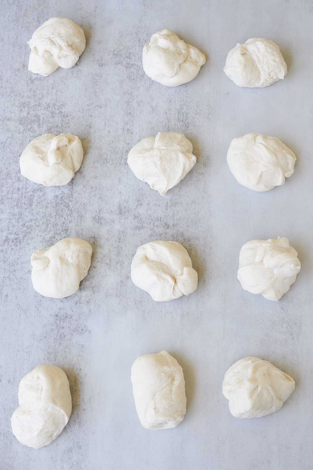 12 dough balls divided to make sourdough breadsticks.