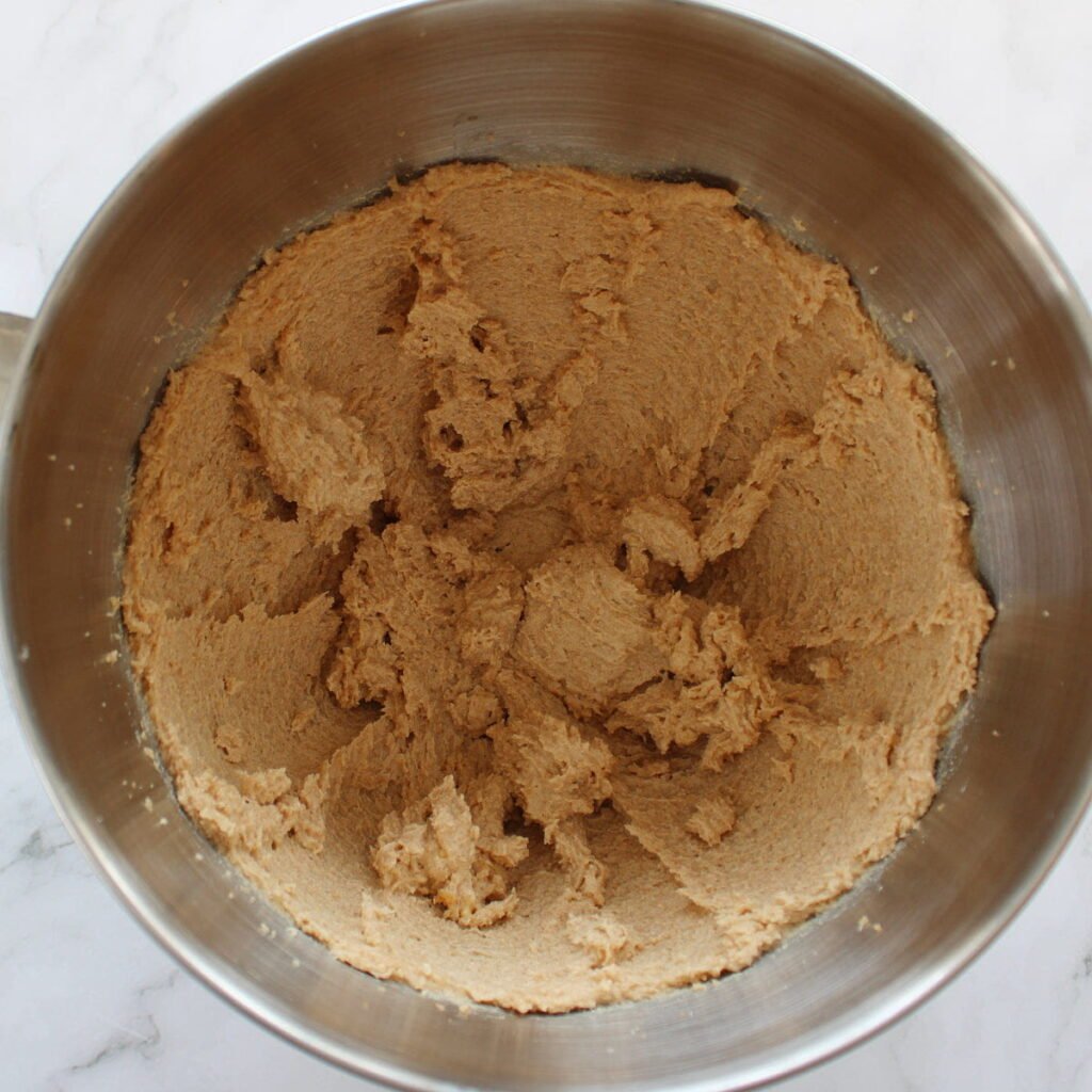 Butter and sugar creamed together in a stand mixer bowl for Sourdough Pumpkin Snickerdoodles.