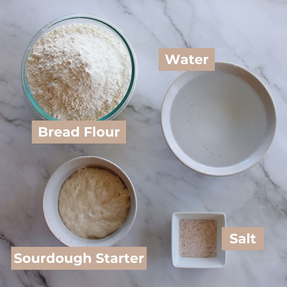 Ingredients for same day sourdough bread in white and clear bowls on a white background.