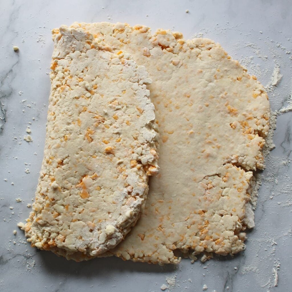 Sourdough Cheddar Biscuit dough folded into thirds.