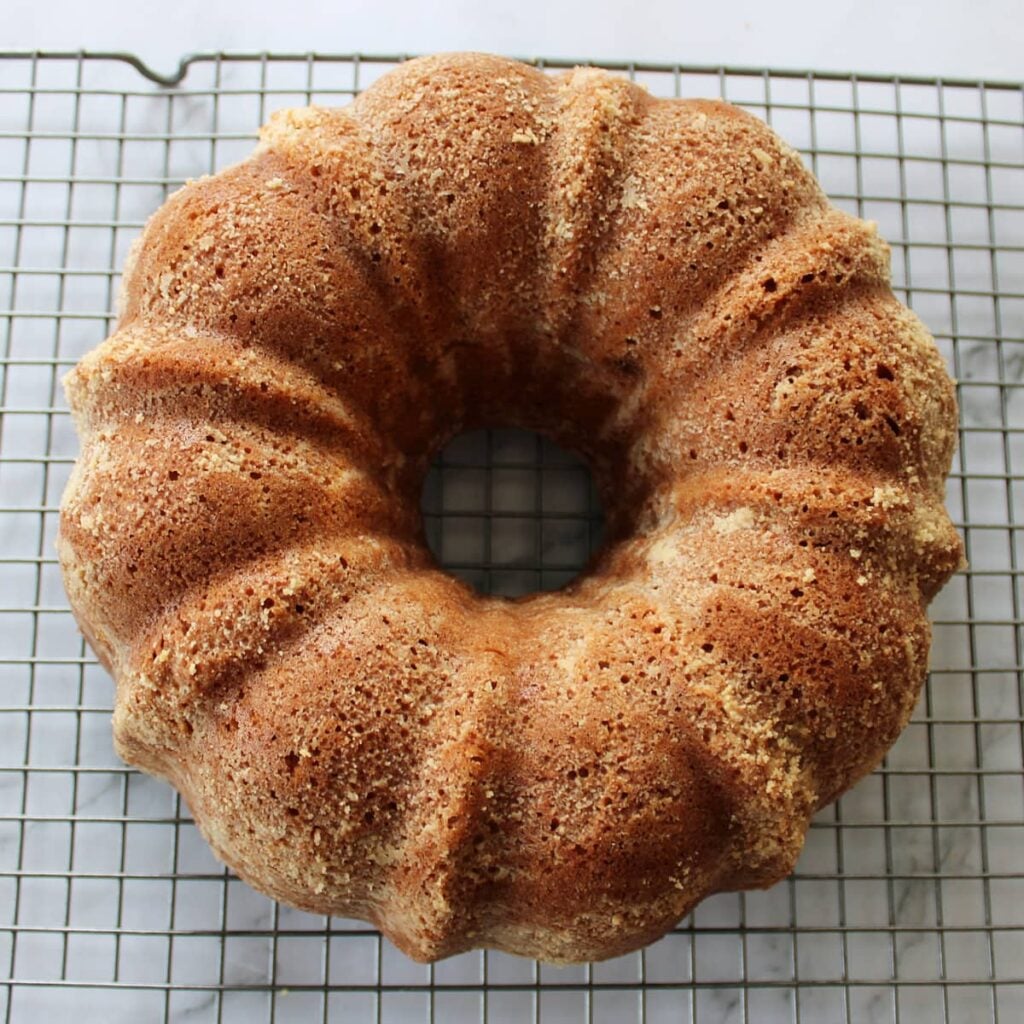 Freshly baked sourdough coffee cake on a cooling rack.