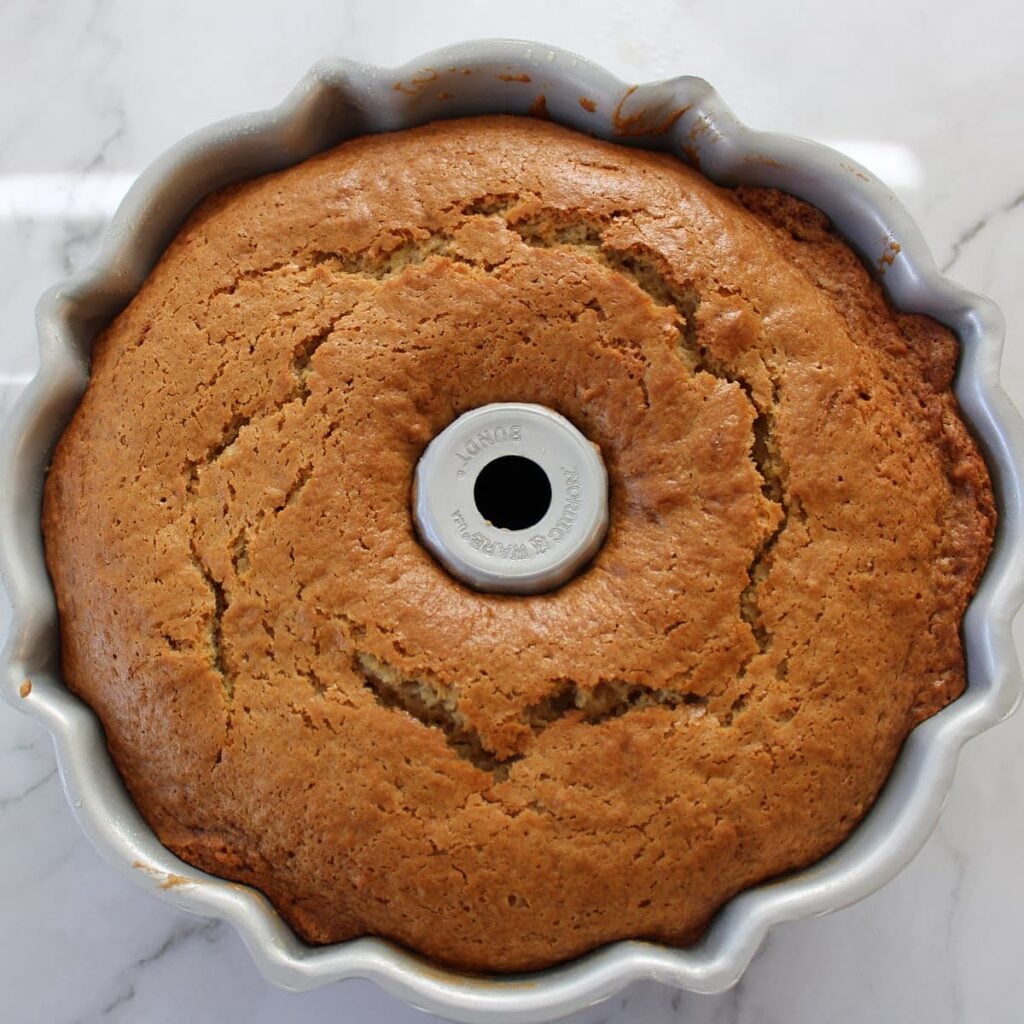 Freshly baked sourdough coffee cake in a bundt pan.