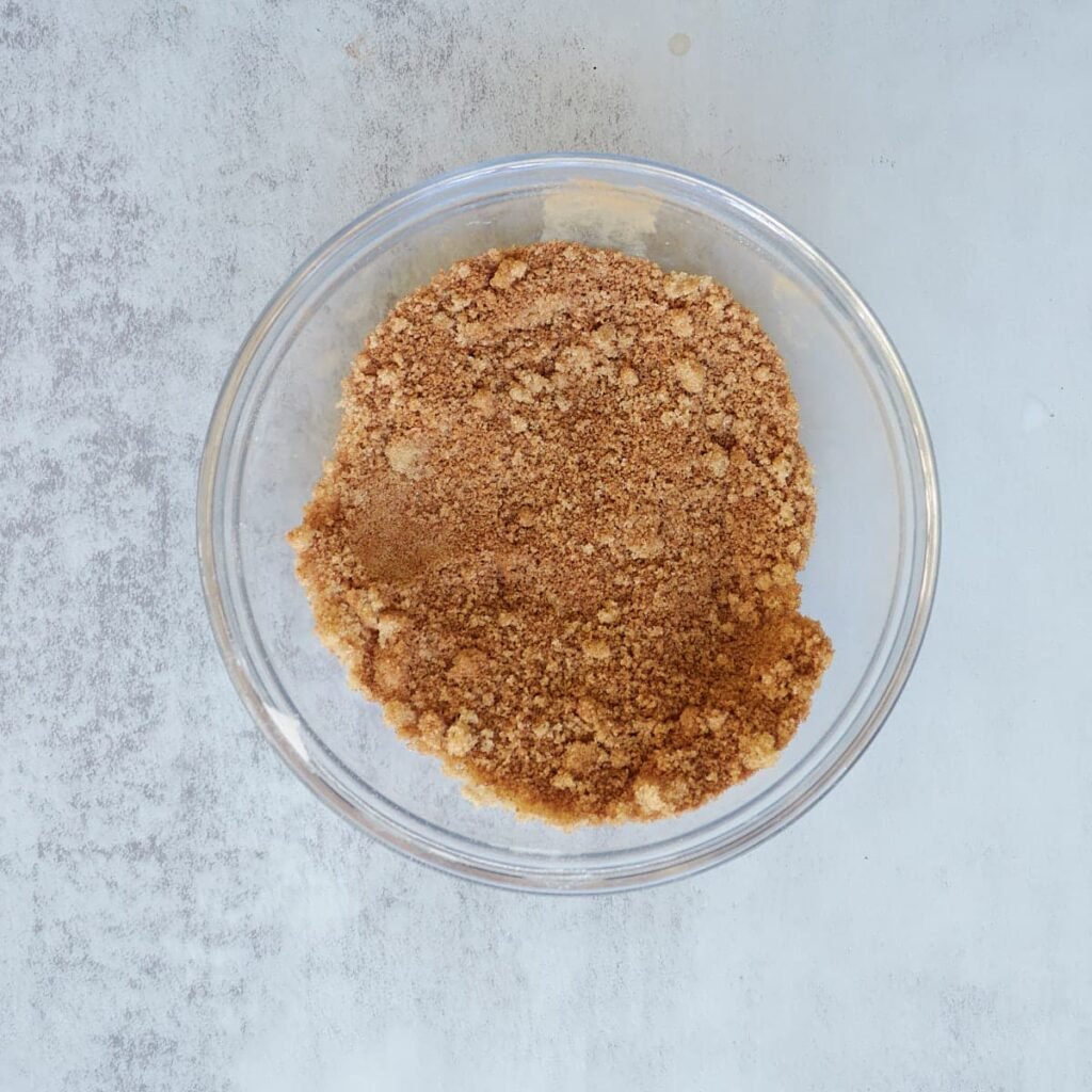 Cinnamon and sugar mixed together in a small bowl.