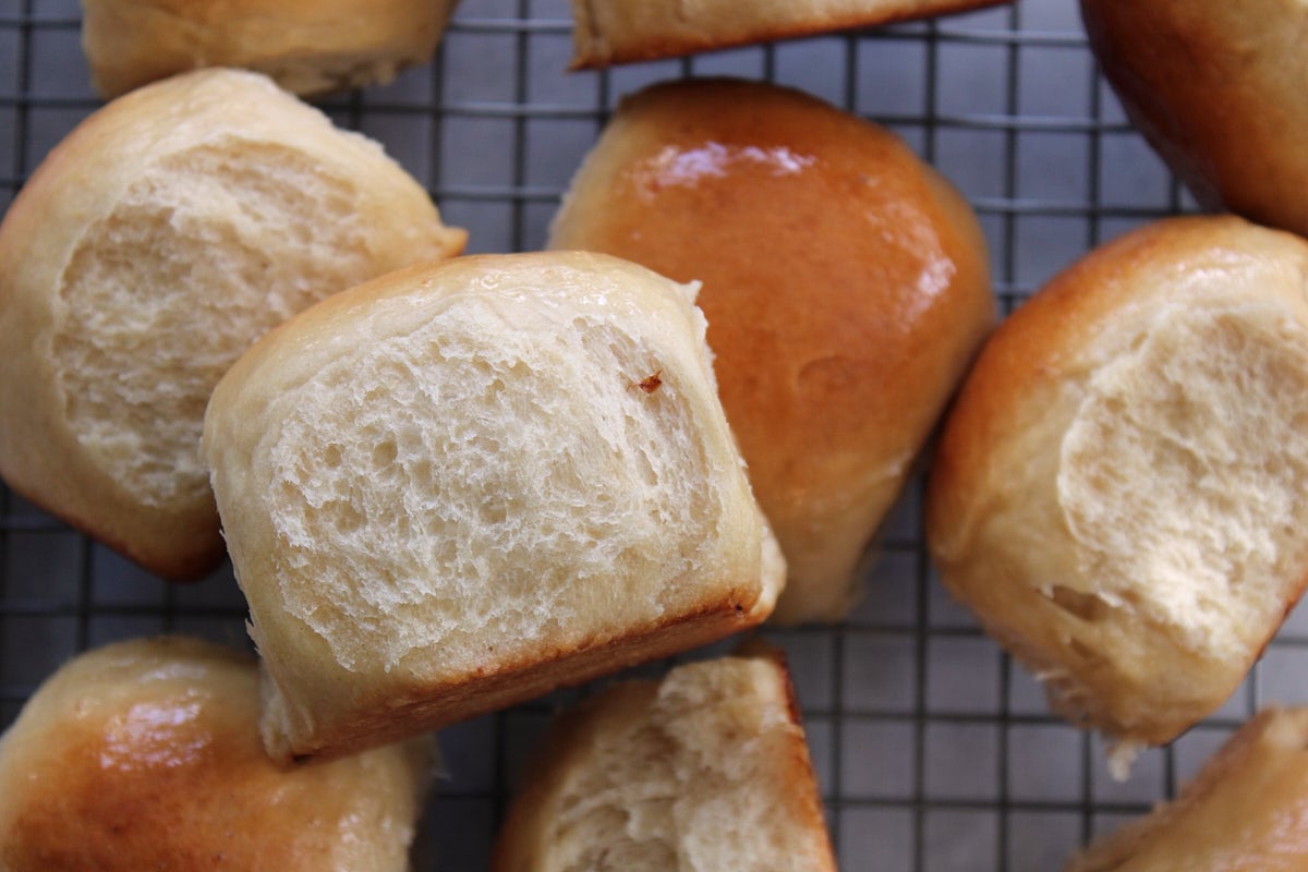 Sourdough Discard Hawaiian Rolls on a wire rack.