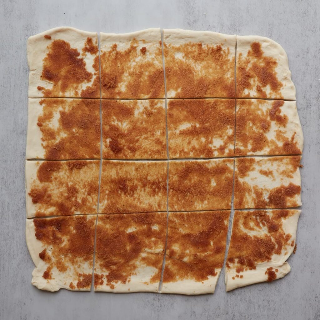 Dough for sourdough apple pie pull apart bread cut into 16 squares.