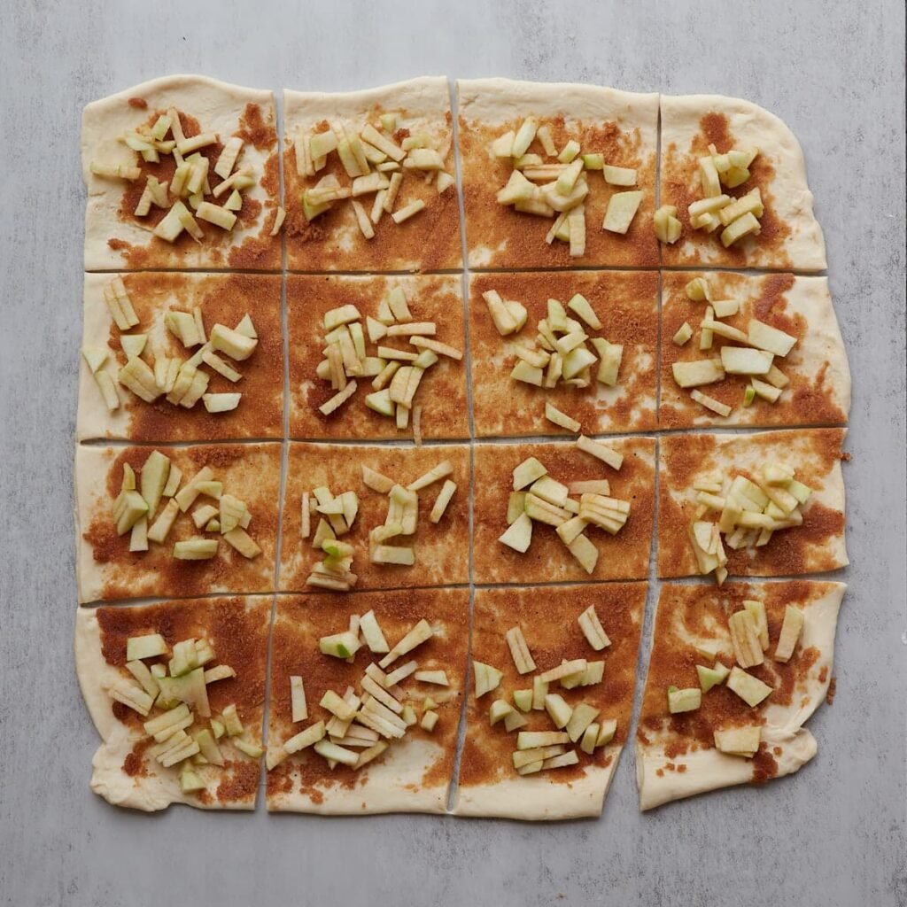 16 dough squares with filling added.