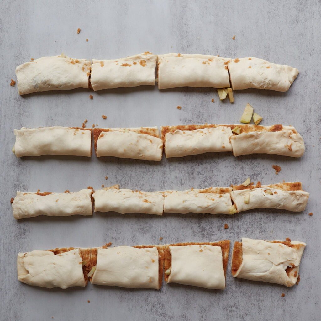 Dough squares with filling added folded in half.