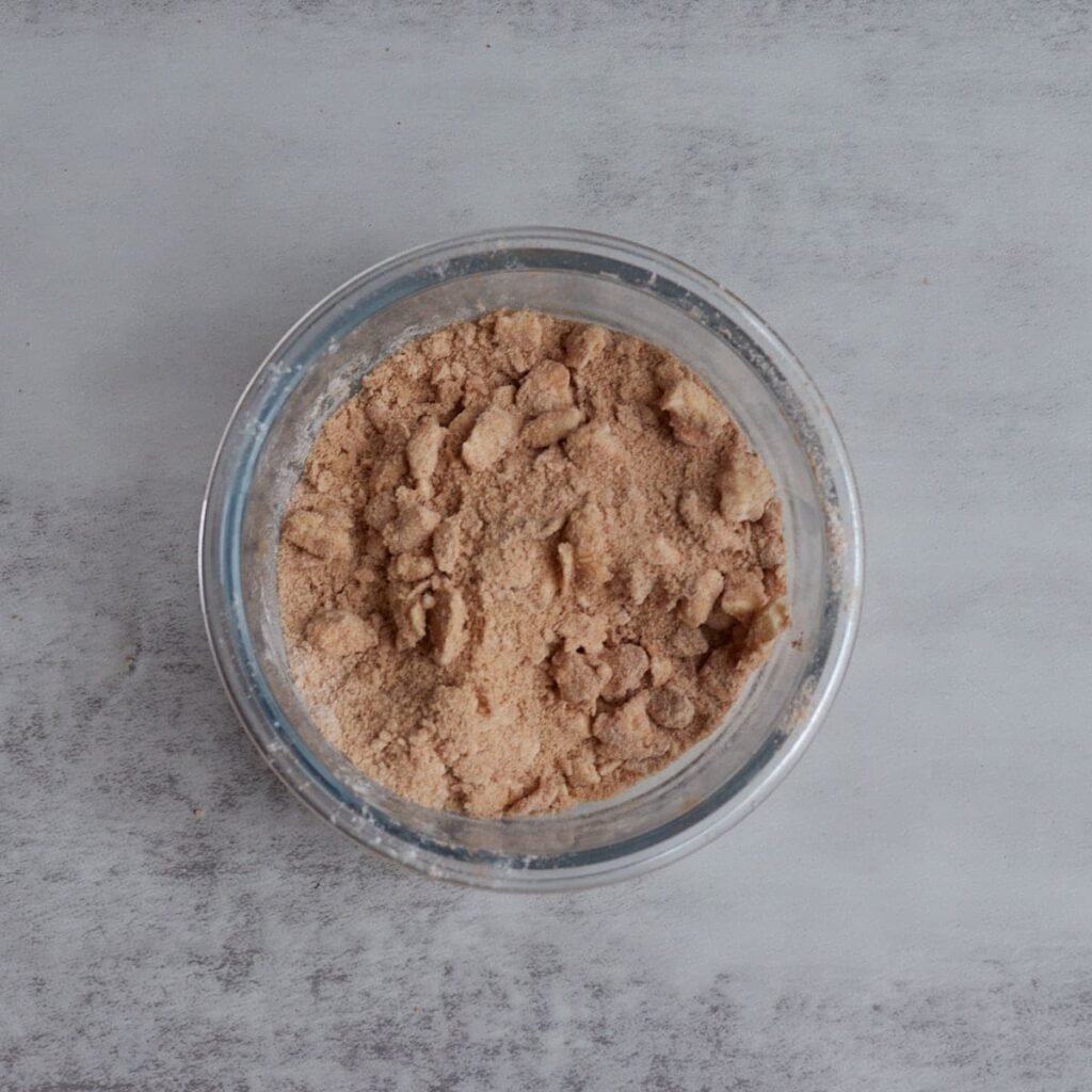Cinnamon streusel mixed in a small clear bowl.